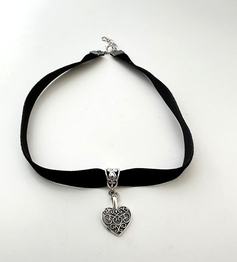 * This handmade boho choker is simple, elegant and so boho.  * Black Velvet ribbon with antique silver heart pendant Love this. * Choker is 13 inches with 2 inches of adjustable extender chain. * Velvet lace is so delicate Please Avoid perfumes and lotions and remove before swimming and bathing etc.    Avoid leaving your jewelry in damp environments. * Gently clean with dry cloth and store in the plastic zip bag and box supplied. * Each piece is packaged with love and ready for gift-giving or just for your own beautiful self! Acssesories Aesthetic, Snowflake Choker, 90s Choker Necklace, Gothic Items, Gothic Choker, Black Velvet Choker, Black Choker Necklace, Boho Choker, Goth Jewelry