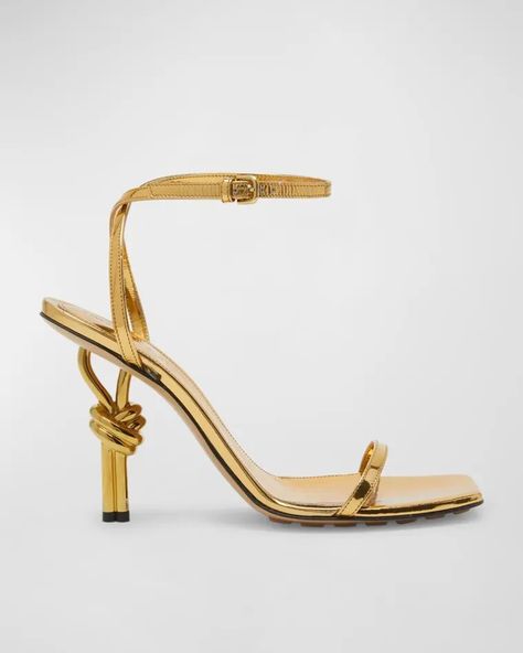 X6C22 Bottega Veneta Metallic Knot-Heel Ankle-Strap Sandals Bottega Veneta Heels, Bottega Veneta Sandals, Trendy Heels, Latest Sandal, Square Toe Sandals, Metallic Shoes, Designer Pumps, Ankle Strap Wedges, Leather Heels Sandals