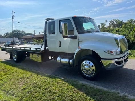 This locally owned truck has no rust, air ride suspension, Cummins turbo Diesel engine, century steel 12,000 pound bed, 21.5 x 102 wide 2 car carrier, with wheel lift towing ball mount, 10,000 pound tow rating on wheel lift, mudflaps, double toolboxes, dual fuel tank. Truck still looks like new and performs perfectly needs nothing. Starter safety kit included as well as all brand new chains and fresh cable this truck needs nothingks, LED lights strobe light bar, alloy wheels. $119,995.00 Trucks For Sell, Cummins Turbo Diesel, Flatbed Towing, Safety Kit, Flatbed Trailer, Car Carrier, Strobe Light, Driving Pictures, Air Ride