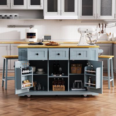 The 3-piece kitchen island set is an ideal addition to any household, blending classic design with luxurious accents and functional storage solutions. The set includes two bar stools, featuring solid wood legs and a 25mm thick stool top. Each stool is sturdy enough to support up to 220 lbs, and the size is 15.7”L x 10.8”W x 25.6”H , making it perfect for enjoying daily breakfasts or leisurely weekend brunches in the comfort of your own kitchen. George Oliver Base Color: Gray Blue | George Oliver Kitchen Island w / 2 Bar Stools brownWood in Gray Blue | 36.4" H X 53.14" W X 29.52" D | Wayfair Manor Kitchen, Drop Leaf Kitchen Island, Mobile Kitchen Island, Rolling Kitchen Cart, Kitchen Storage Cart, Rolling Kitchen Island, Kitchen Island Cart, Large Kitchen Island, Mdf Frame