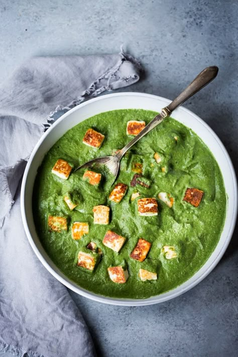 Palak Paneer - a smooth and creamy spinach sauce infused with Indian spices becomes a delicious base for pan-seared paneer. Use the flavorful spinach sauce over tofu, roasted veggies or even pan-seared chicken or fish. Perfect for mixed households. Fast and easy,  Keto-friendly, Gluten-free! And the wheel goes round and round, and the flame in our souls will never burn out. ~Rosanne Cash~ You may know this recipe as Saag Paneer, but this recipe is actually called Palak Paneer, or so I was told w Saag Paneer Recipe, Creamy Spinach Sauce, Lectin Free Recipes, Creamed Spinach Recipe, Feasting At Home, Saag Paneer, Paneer Cheese, Paneer Recipe, Lectin Free