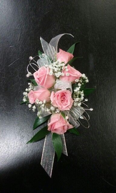 Pink sweetheart roses Senate with baby's breath the silver Bling Corsage Pink Rose Corsage Prom, Prom Crossage Ideas Pink, Baby Pink Corsage, Pink And Silver Corsage, White And Pink Corsage, Light Pink Corsage, Pink And White Corsage, Pink Corsage And Boutonniere, Pink Corsages