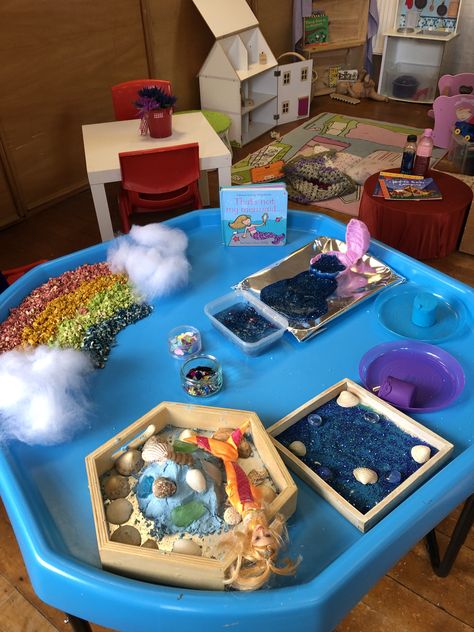 Mermaid themed sensory tray based on the “That��’s not my mermaid book” Mermaid Tuff Tray Ideas, Seaside Tuff Tray Eyfs, Rainbow Fish Tuff Tray, Mermaid Messy Play, Under The Sea Tough Tray, Mermaid Book, Playgroup Ideas, Sensory Tray, Mermaid Books