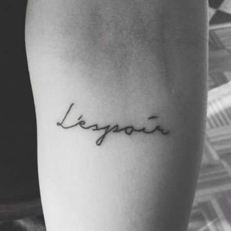 20 One-Word Tattoo Ideas For The Minimalistic Woman Tattoo Ideas In French, L'espoir Tattoo, Espoir Tattoo, One Word Tattoo Ideas, French Tattoo Quotes, French Word Tattoos, Latin Tattoo, One Word Tattoo, Word Tattoo Ideas