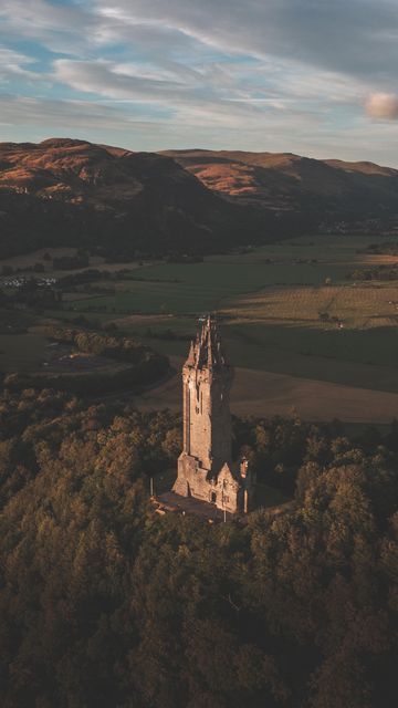 Bryan Evans // Scotland on Instagram: "Do you know this monument? Did you know it is built on the hill that William Wallace and Andrew Moray stood in wait for the English in 1297 at the Battle of Stirling Bridge? Abbey Craig was the ideal view point to see the opposing forces crossing the narrow wooden bridge and make the decision to advance at the pinch point a decision that helped win the battle. #stirling #nationalwallacemonument #visitscotland #scottishhistory #travelscotland #dronevideo Battle Of Stirling Bridge, Wallace Monument, William Wallace, Uk History, Drone Video, Wooden Bridge, Visit Scotland, Scottish Castles, Stirling