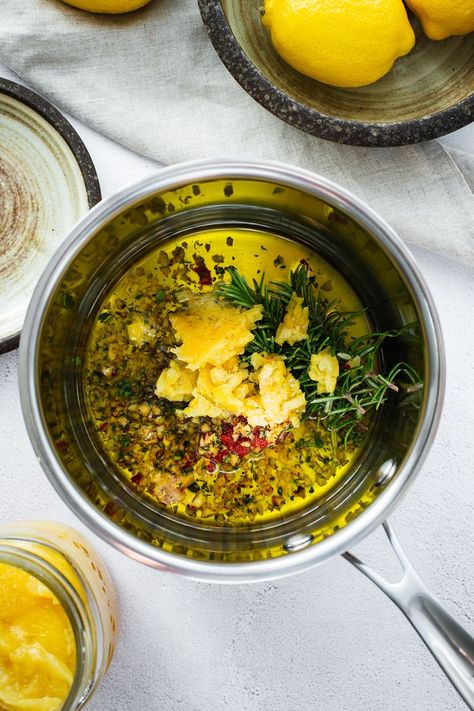 Yotam Ottolenghi and Noor Murad’s preserved lemon, chilli and herb oil from OTK: Shelf Love is inspired by the flavours of the Mediterranean. Use it to marinade butter beans or other pulses (like chickpeas), drizzle it over just-cooked veggies such as broccoli or cauliflower, or simply spoon it over hummus or labneh and serve it with loads of fluffy flatbread. Vegan | Vegetarian | Preserved Lemon | Mediterranean | Recipe | Ottolenghi Test Kitchen | Infused olive oil Lemon Preserves Recipes, Preserved Lemon Sauce, Preserved Lemon Recipes, How To Make Lemon Infused Olive Oil, Preserved Lemon Recipes Using, Fluffy Flatbread, Preserved Lemons How To Make, Using Preserved Lemons, Lemon Infused Olive Oil