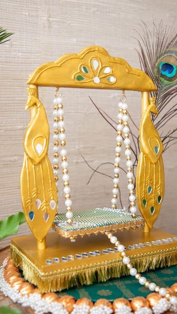 Mitesh | Home & Design on Instagram: "We are all ready for the arrival of little Krishna. I thought about making and sharing a DIY jhoola for Janmashtami when @shubbh__laabh reached out with their homemade little swing which can be customized. Using their basic swing I added my own DIY touch. I used model magic from @crayola because of its lightweight nature to mold side peacock motifs and an top panel. These were embellished with some 3-dimensional paint and gold paint followed by mirror pieces Krishna Jula Diy, Jhoola For Krishna, How To Make Krishna Jhula At Home, Krishna Diy Craft, Krishna Jhoola Decoration, Krishna Palna Decoration, Krishna Jhoola Diy, Janmashtami Decoration Ideas Home Krishna Diy, Krishna Jhula Diy At Home