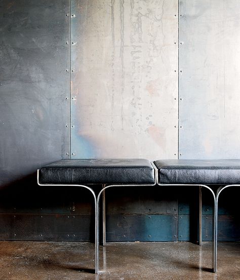 An aluminum bench harmonizes with the industrial nature of the galvanized-steel walls and the polished concrete floor within a metal broker's Collingwood, Ontario, house. Photo by Lorne Bridgman. Metal Facade, Design Industrial, Polished Concrete, Furniture Details, Steel Wall, Interior Furniture, Concrete Floors, Interior Details, Interior Spaces