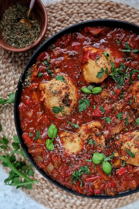 Chicken cacciatore is a delicious Italian dish with a rich, rustic sauce. I oven-baked this, as I love it when chicken thighs are fall apart tender, and the tomato sauce has broken down to be rich and dark. Not only is this a very tasty dish, it's a great way to pack veg into the sauce. On top of what I have used in this recipe, you ... Italian Baked Chicken, Crispy Oven Baked Chicken, Cacciatore Recipes, Chicken Cacciatore Recipe, Chicken Thigh Recipes Oven, Chicken Cacciatore, Cook Chicken, Oven Chicken, Baked Chicken Thighs