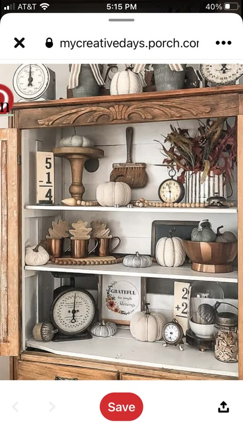 Above Armoire Decor, Moody Bookshelf, Fall Hutch Decor Ideas, Bookcases Styling, Kitchen Hutch Decor, Armoire Decor, Vintage Booth, Vintage Fall Decor, Fall Coffee Table