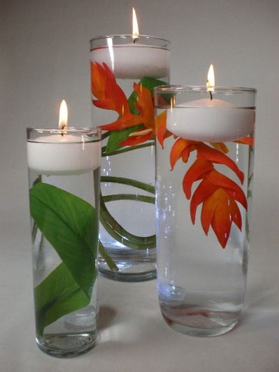 Also, fill glass with raw popcorn kernels and stick candle in the middle Floating Candle Centerpieces, Bridal Shower Centerpieces, Deco Nature, Floating Flowers, Shower Centerpieces, Tropical Theme, Deco Floral, Candle Centerpieces, Leaf Decor