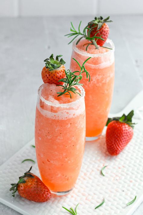 This frozen strawberry salty dog recipe features vodka, strawberries, and grapefruit juice. This frozen cocktail takes just 5 minutes to make and delivers a sweet and sour punch! A slushie cocktail with flavorful berries and juice, this drink just screams spring and summertime! Vodka Strawberries, Salty Dog Cocktail, Dog Cocktail, Sour Punch, Frozen Drink Recipes, Frozen Cocktail, Margarita Salt, Craft Cocktail Recipe, Frozen Strawberry