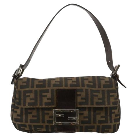 Fendi Baguette Classic Zucca Print Fendi Monogram These are professional photos of the actual bag offered by Luxbags. Introducing the Fendi Baguette, a classic icon featuring the beloved Zucca print. This vintage brown shoulder bag is a must-have for fashion lovers, bringing both style and functionality. Carry your essentials in the epitome of timeless elegance. Model: Fendi Baguette;Size: Medium;Condition: Very good vintage condition;Exterior Material: Canvas;Exterior Color: Brown;Strap Material: Leather;Strap Color: Brown;Hardware Color: Silver;Lining Material: Nylon;Lining Color: Brown Fendi Baguette Vintage, Fendi Vintage Bag, Vintage Fendi Baguette, Fendi Zucca Baguette, Chloe 2024, Fendi Monogram, Fendi Baguette Bag, Classic Icon, Fendi Vintage