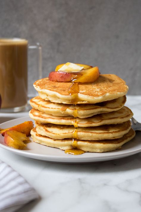 Made with fresh peaches and maple peach topping, these healthy peach pancakes are light and fluffy and a perfect summer breakfast. Healthy Peach Recipes, Peach Pancakes, Classic Pancake Recipe, Light And Fluffy Pancakes, Peach Syrup, Summer Brunch, Summer Breakfast, Baking Essentials, Canned Peaches