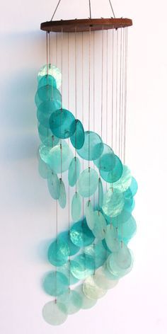 Turquoise Spiral Cascading Capiz Shell Chime Capiz Shell Crafts, Shell Lighting, Capiz Wind Chimes, Luminaria Diy, Capiz Shell Chandelier, Seashell Wind Chimes, Wind Chimes Homemade, Shell Wind Chimes, Shell Mobile