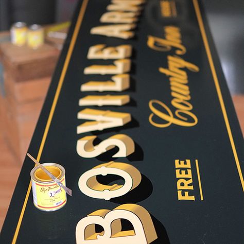 Traditional pub signwriting for the Bosville Arms, Rudston. Black green background with ivory lettering and gold block shade. Gold Leaf Signs, Paul Banks, Sign Painting Lettering, Sign Writer, Gold Leaf Design, Photoshop Design Ideas, Tattoo Signs, Calligraphy Art Print, Yorkshire Uk