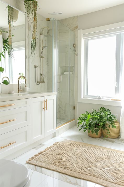 Bright and Airy Bathroom Oasis • Freshen up your mornings with this light-filled bathroom featuring sleek white cabinets and gold hardware. • The glass shower adds a modern touch, making the space feel open and inviting. • Lush green plants bring a touch of nature indoors, creating a relaxing vibe. • A cozy woven rug adds texture and warmth to the polished marble floor. • Large windows let in plenty of natural light, perfect for a refreshing start to the day. White Cabinets And Gold Hardware, Light And Airy Bathroom, White Spa Bathroom, White Quartz Bathroom, Modern Spa Bathroom, Ranch Bathroom, Airy Bathroom, Vibe Bathroom, Bathroom Cozy