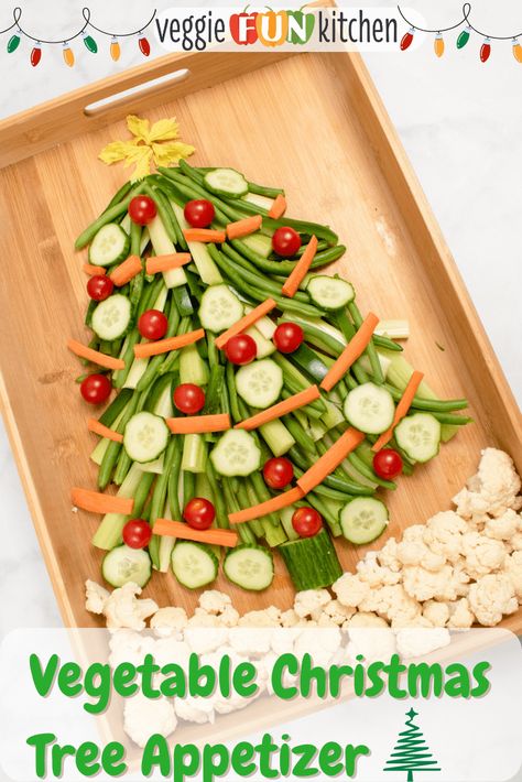 This festive Christmas Tree Appetizer is fun and easy to make with fresh vegetables like pea pods, green beans, celery, carrots, and bell peppers. Decorate the veggie Christmas tree with cherry tomatoes and cucumber, all "standing" on a bed of cauliflower. Choose your favorite dips and sauces (see below) to complete this yummy Christmas tree vegetable tray. Vegetable Christmas Tree, Veggie Christmas Tree, Vegetable Christmas, Turkey Fruit Platter, Christmas Tree Veggie Tray, Christmas Tree Appetizer, Tree Appetizer, Christmas Veggie Tray, Veggie Christmas