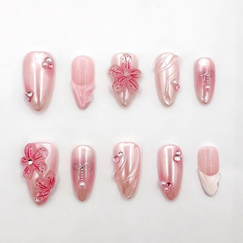 Pink floral press-on nails with 3D flower and pearl designs. Custom-made long almond faux acrylic nails with an elegant floral touch. 🫰 Materials and Craftsmanship  High-quality 3D gel handmade, delicately hand-painted, with multi-element decorations. These sturdy, long-lasting luxury press-on nails are ones you can trust. 🚚 Free Shipping 📏 𝐒𝐢𝐳𝐞 -S: 15mm, 11mm, 12mm, 11mm, 9mm -M: 16mm,12mm,13mm,12mm, 10mm -L: 17mm, 13mm, 14mm, 13mm, 11mm If you need a custom size, just fill out the perso Flower Nail 3d, Acrylic Nails 3d Designs, Light Pink Flower Nails, Short Tropical Nails, 3 D Flower Nails, Acrylic Nail Designs Pink, Pink 3d Nails, Nail Charm Designs, 3d Nails Design