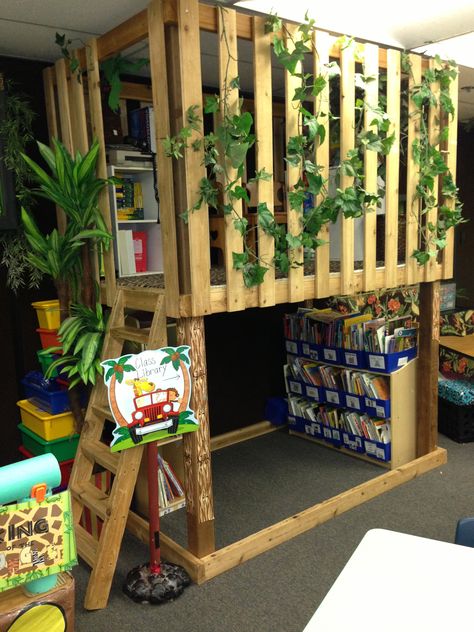 Jungle classroom library   Brittany's response: I just love this classroom library!!! I would love have such an alive space in my classroom!!! Loft In Classroom, Classroom Treehouse, Treehouse Classroom, Jungle Reading Corner Classroom, Jungle Classroom, Jungle Tree Classroom, Classroom Library Seating, Rainforest Reading Corner, Diy Classroom Tree Reading Corners