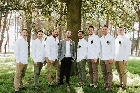 Tan, brown, and olive khaki shades keep your guys' looks in sync, while adding just a hint of casual variety. Warehouse Reception, Rustic Groomsmen Attire, Greenery Pantone, Casual Groomsmen, Olive Bridesmaid Dresses, Casual Groom Attire, Wedding Planning List, Groomsmen Suspenders, Casual Grooms