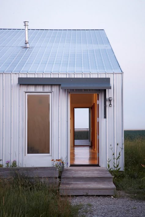 Exterior, Metal Siding Material, and Gable RoofLine “There’s a presence to that place—it’s vast, and constantly shifting,” Moffitt says. “It was clear that this house should be an observation shed for the changing landscape beyond.” Photo 11 of 11 in An Off-Grid Home That Relies on the Sun and the Wind Modern Shed, Rural House, Metal Siding, Shed Roof, Shed Homes, Shed Design, Wood Siding, Prefab Homes, Metal Buildings