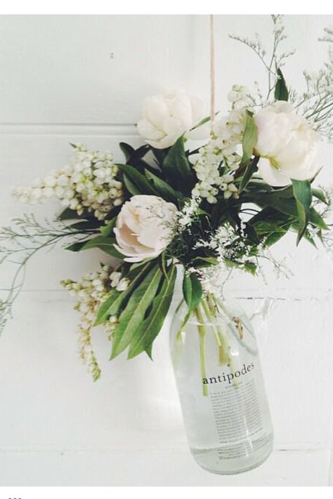 Flowers in antipodes water bottle- love Antipodes Water, Blue Vase Centerpieces, Flowers In Water, Pretty Vase, Wedding March, Diy Wedding Inspiration, Bottle Centerpieces, 21st Party, Pink Vase