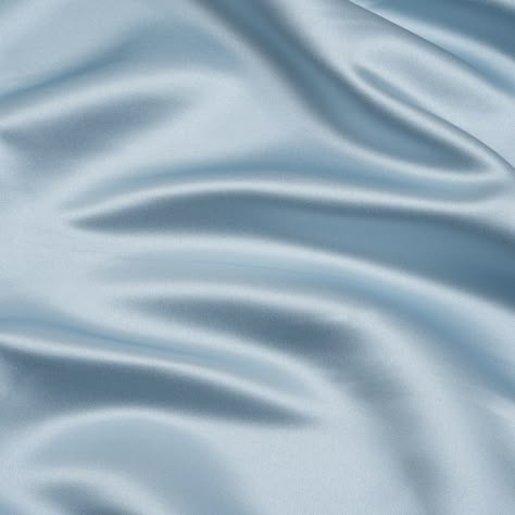 This icy Baby Blue Premium Polyester Satin has a chilly opulence. Featuring a medium weight, sleek hand, and fluid drape, it’s the perfect choice for eye-catching evening wear.Suggested Projects:  Dresses, Skirts, Blouses, ShirtsContent:  100% PolyesterStretch:  NoneOpacity:  OpaqueCome in from the cold and luxuriate in this baby blue satin. A sleek hand, lustrous face, and fluid drape combine to deliver affordable elegance to your wardrobe. This medium-weight, pale blue fabric enjoys a simple s Satin Aesthetic, Mood Designer Fabrics, Blue Satin Dress, Baby Blue Aesthetic, Free Sewing Pattern, Mood Fabrics, Baby Blue Colour, Blue Texture, Color Analysis