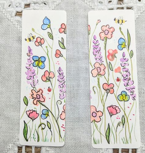 🌸📚 Fun Fact: Did you know that reading reduces stress by 68%? 🌼 Dive into your favorite book with these hand-painted floral bookmarks! Each one is a mini artwork, featuring whimsical wildflowers and buzzing bees. Perfect for adding a touch of nature to your reading adventure. 🐝🌿 #Handmade #WatercolorArt #Bookmarks #BookLovers #Reading #NatureArt #BethsBrushwork Cute Hand Drawn Bookmarks, Hand Drawn Bookmarks, Drawn Bookmarks, Floral Bookmarks, Mini Artwork, Reading Adventure, Fun Fact, Floral Painting, Nature Art