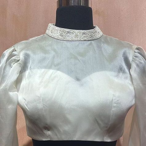 BlouseHousebyMahithaPrasad on Instagram: "Embrace sophistication with our pearl-accented white organza blouse that takes inspiration from European fashion. A contemporary take on tradition ensemble, this made-to-order ivory blouse is a versatile classic for the progressive women of today. Versatile in its appeal, this blouse effortlessly transitions from contemporary ensembles to traditional sarees and lehengas, allowing you to showcase your individuality in any setting. Its modern design, f White Organza Choli With Pearl Embroidery, Unstitched Silk White Blouse Piece, White Unstitched Organza Blouse Piece, Luxury Semi-stitched Organza Blouse Piece, Semi-stitched Organza Blouse, Ivory Blouse, Organza Blouse, Traditional Sarees, European Fashion