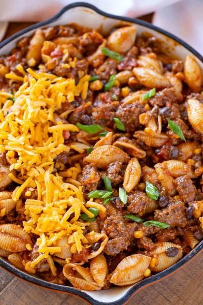 Cheesy Tex Mex Pasta Tex Mex Pasta, Seasoned Ground Beef, Rigatoni Pasta, Easy Cheesy, Rigatoni, Bell Peppers, Tex Mex, One Pot, Cheddar Cheese