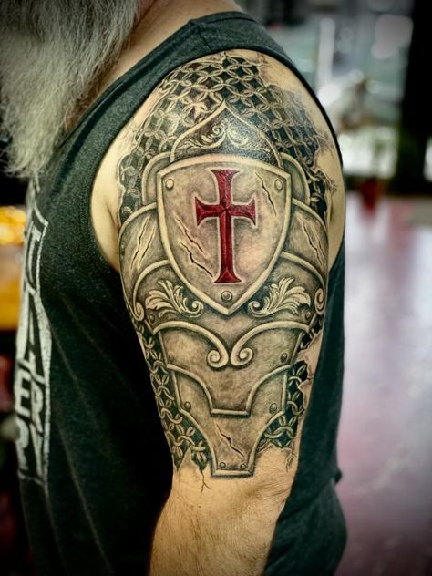 Crusader tattoos have been growing in popularity as unique ways of expressing their personal identities, beliefs, and stories. These intricate designs, ... Crusader Shield Tattoo, Armor Of God Tattoo Ideas, Christian Crusader Tattoo, Dragon Knight Tattoo, Crusader Cross Tattoo, Crusades Tattoo, Templar Shield Tattoo, Crusader Tattoo Sleeve, Celtic Compass Tattoo