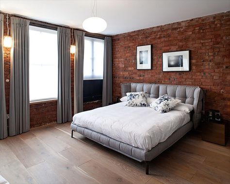 Gray brings contemporary elegance to the bedroom with exposed brick walls [Design: Peter Landers Photography] Brick Wall Bedroom Ideas, Brick Bedroom Ideas, Brick Bedroom Wall, Bedroom Brick Wall, Brick Finishes, Orange Bedroom Walls, Brick Window, Wall Bedroom Ideas, Brick Wall Bedroom