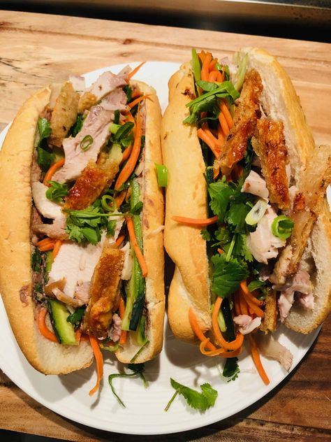 Recreate these delicious crispy pork bahn mi rolls at home with my easy to follow recipe. Also known as a bahn mi sandwich. All you need is leftover pork roast and a few other simple ingredients and you will be fighting into these mouthwatering bahn mi rolls. A classic Vietnamese street food. Hear the crunch in every bite. the ultimate fakeaway. The crispy pork, fresh herbs and pickled carrot make these traditional pork rolls irresistible. Roast Pork Banh Mi, Vietnamese Roast Pork, Pork Roll Sandwich, Pork Roll Recipes, Bahn Mi Pork, Pork Bahn Mi Sandwich, Pork Belly Bahn Mi, Vietnamese Food Traditional, Pork Bahn Mi