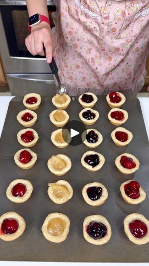 Cute and easy summer treat | Cute and easy summer treat

Kyra makes sugar cookie cups using pie filling in her mini muffin tin. | By Kiera & Ryan & Danny & Justine | Alright, we placed our
twenty-four sugar cookie dough pieces into our mini muffin
tin. This is going in the oven at 350 for 18 minutes. Alright,
guys. These were baking for about 18 minutes and I went
ahead and let them cool down for five before we move on to
our next step. We're taking a little spoon here and we're
just going to use the back of it to gently push a little
divot into our little sugar cookie just like that. We're
going to do that to each and every one of these for this
super cute, crowd-pleasing and easy dessert. I'm telling you
guys, these are going to be so good and they are so fun and
cute. Alright, last one. Individual Pies In Muffin Tin, Sugar Cookie With Fruit, Sugar Cookie Cups Muffin Tin, Cookie Cups Muffin Tin, Panera Pumpkin Muffin Recipe, Pillsbury Sugar Cookie Dough, 2022 Ornaments, Mini Lemon Tarts, Cookie Dough Cups