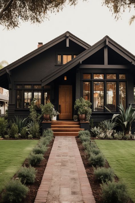 40+ Elegant Black Home Exterior Ideas Black House Black Roof, Black Exterior Garage Doors, Moody Craftsman Exterior, Small Home Exterior Ideas, Small House Exterior Colors, Dark Exterior House Colors, Black Home Exterior, Home Exterior Ideas, Painting Brick