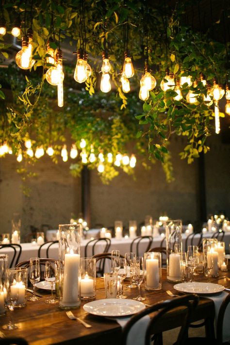 edison bulb and green vine installation over reception tables // wedding, candle centerpiece, lighting, mood, ambiance, industrial, farm table, rustic Edison Bulb Wedding, Candles And Flowers, Candlelit Reception, Wedding Reception Lighting, Ceremony Candles, Wedding Backyard Reception, Simple Wedding Decorations, Candle Table, Wedding Reception Tables