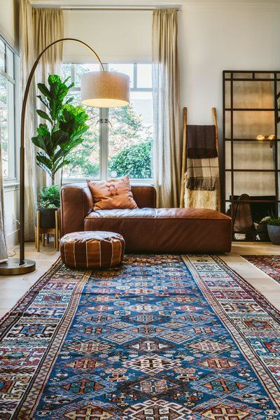 Photo 4 of 19 in A Mediterranean style urban oasis with warm industrial and bohemian eclectic twist by Saffron Bloom Antique Rugs - Dwell Chill Lounge, Warm Industrial, Bedroom Seating Area, Mediterranean Interior, Light Hardwood Floors, Warm Home Decor, Bedroom Seating, Mediterranean Decor, Rug Inspiration