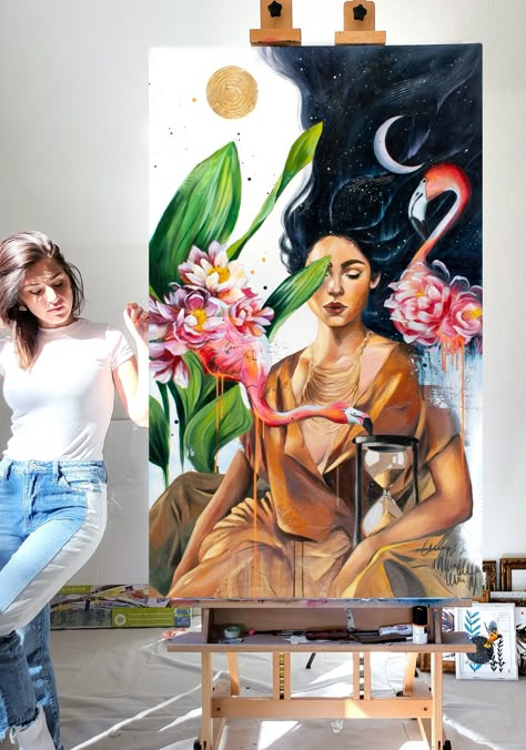 a female artist next to her painting of a dreamy woman surrounded by florals and flamingos Art Studio Setup, Woman And Flowers, Paintings Of Women, Art Portrait Painting, Floral Portrait, Garden Of Flowers, Art Shed, Painting Of A Woman, Diy Abstract Canvas Art