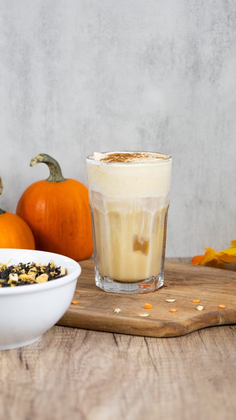 Iced Pumpkin Chai Latte on a brown cutting board, next to small pumpkins and loose-leaf Pumpkin Chai tea Copycat Starbucks Iced Pumpkin Cream Chai Tea Latte, Cold Foam Recipe, Chai Latte Starbucks, Pumpkin Chai Tea, Foam Recipe, Vegan Taco Salad, Iced Chai Latte, Pumpkin Bread Pudding, Vegan Carrot Cakes