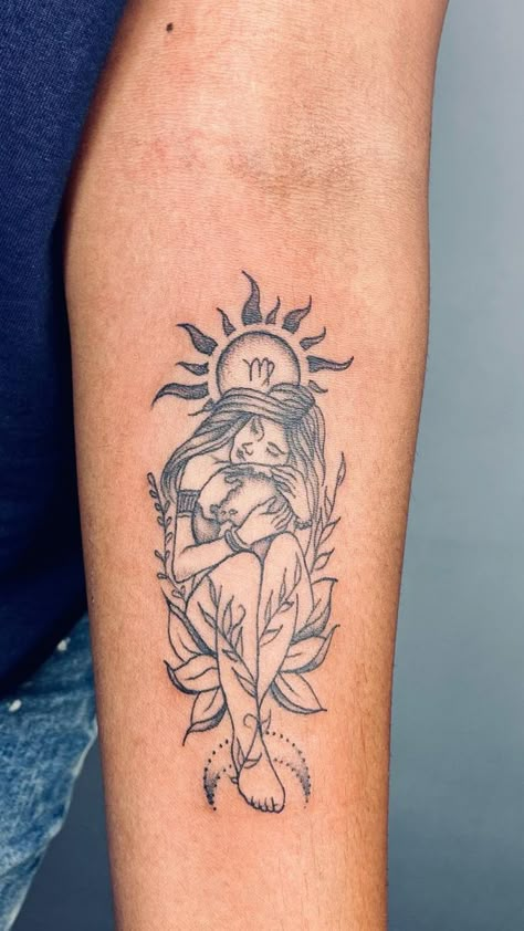 Elegant Virgo tattoo design featuring a woman cradling the Virgo zodiac symbol with the sun's rays behind her, wrapped in foliage - a serene tattoo choice for Virgo women. Virgo Tattoo Ideas For Women, Tattoo For Women Upper Arm, Feminine Tattoos With Meaning, Feminine Taurus Tattoo, Feminine Tiger Tattoo, Virgo Women Tattoo, Virgo Tattoo Ideas, Feminine Back Tattoos, Virgo Tattoo Designs