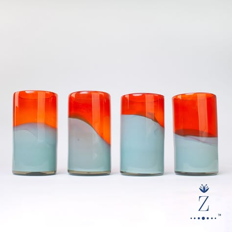 Accentuate your drink-ware collection with handblown Candy Glass Tumblers. Tall vibrant bi-color mandarin & teal cups add bold color variation with sense of sophistication to any gathering. A Zenwaro design, these eclectic vessels are crafted from 100% recycled glass by free-thinking master artisan glassblowers. Drink-in the creativity!  Available individually, set of 2 , set of 4, or set of 6. 100% handmade from recycled materials, these Tumblers and all of our Movement glassware is toxin free Hand Blown Glass Cups, Colorful Glassware, Mexican Glassware, Colorful Cocktails, Cocktail Glassware, Drink Ware, Aqua Glass, Glass Tumblers, Toxin Free