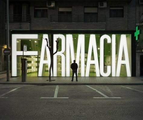 Freshome.  Clavel Arquitectos completed the impressive 180 square meter Casanueva Pharmacy in Murcia, Spain. Display Visual Merchandising, Window Signage, Retail Facade, Storefront Design, Exterior Signage, Pharmacy Design, Shop Front Signage, Window Graphics, Environmental Graphic Design