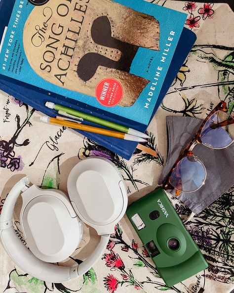 a book, journal, film camera, pencils, headphones, glasses and a mask on top of a floral tote bag Greek Mythology Books, Mythology Books, Bookish Things, Book Reader, Greek Mythology, Book Aesthetic, New York Times, Random Stuff, Cafe