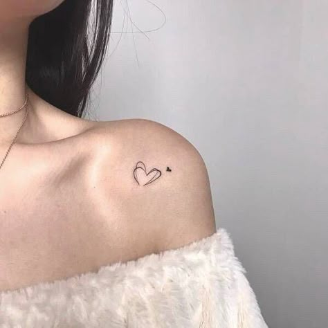 Minimalistic heart tattoo located on the shoulder. Minimalistic Heart Tattoo, Heart Tattoo Shoulder, Two Hearts Tattoo, Community Tattoo, Common Tattoos, International Tattoo, Tattoo On Shoulder, Tattoo Spots, Omerta Tattoo Design