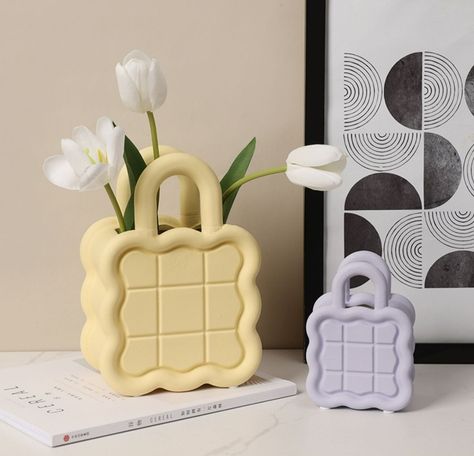 Show your love for flowers with this Ceramic Wavy Bag Vase. It is perfect for your fresh flowers and the color is perfect for your Pastel aesthetic. It is made of ceramic material that is easy to… Clay Ideas For Room Decor, Creative Ceramics Ideas, Ceramic Bag, Handbag Vase, Ceramic Aesthetic, Bag Vase, Pastel Room Decor, Pastel Room, Art Decor Diy