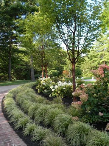 Flowers Around Driveway, Driveway Plants Ideas, Half Circle Driveway Ideas Front Yards, U Shaped Driveway Landscaping, Landscape Between Driveways, Long Driveway Landscaping Country Roads, Round About Driveway Landscaping, Semi Circle Driveway Landscaping, Driveway Flower Bed Ideas