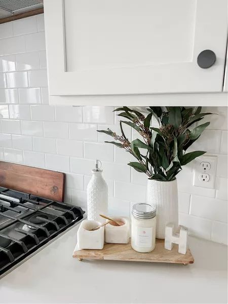 Simple yet chic white marable salt and pepper bowls with a wooden kitchen counter tray that sits perfectly with a candle and some addiontal pieces to bring it to life. #marblesaltandpepperbowls #homedecor #kitcheninspo Wooden Tray For Kitchen Counter, Salt And Pepper Kitchen Counter, Kitchen Salt And Pepper Tray, Salt And Pepper Decor, Diy Dining Table Centerpiece, Wooden Kitchen Counter, Salt And Pepper Bowls, Kitchen Counter Tray, Kitchen Color Scheme