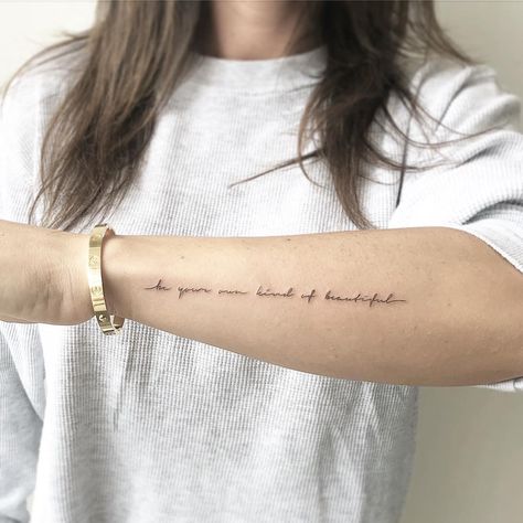 A quote ‘Be your own kind of beautiful’ tattooed on the left forearm by @joannamroman Arm Tattoo Writing For Women, Inner Forearm Script Tattoo, Small Font Tattoo Writing, Tattoo Text Idea, Inner Arm Script Tattoo, Tattoo On Outside Of Forearm, To Each Their Own Tattoo, Signature Tattoo Ideas Handwriting, Arm Saying Tattoos For Women