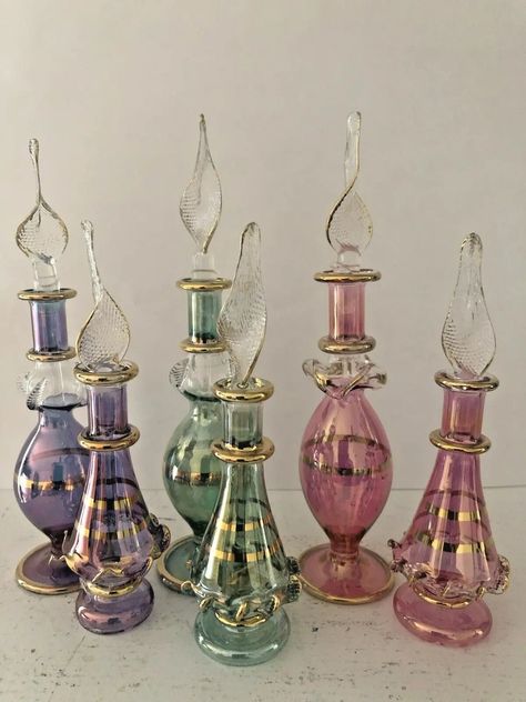 Set of 6 bottles measures 2, 4, and 5 inches The set may vary in color or shape Mouth Blown Egyptian Perfume bottles is an ancient art. These bottles are so small and tiny you will appreciate the craftsman work behind this work of art. Ideal to give as gifts and wedding favor. Egyptian Perfume, Egyptian Perfume Bottles, Pretty Perfume Bottles, Good Whiskey, Genie Bottle, Antique Perfume Bottles, Art Ancien, Christmas Handmade, Antique Perfume